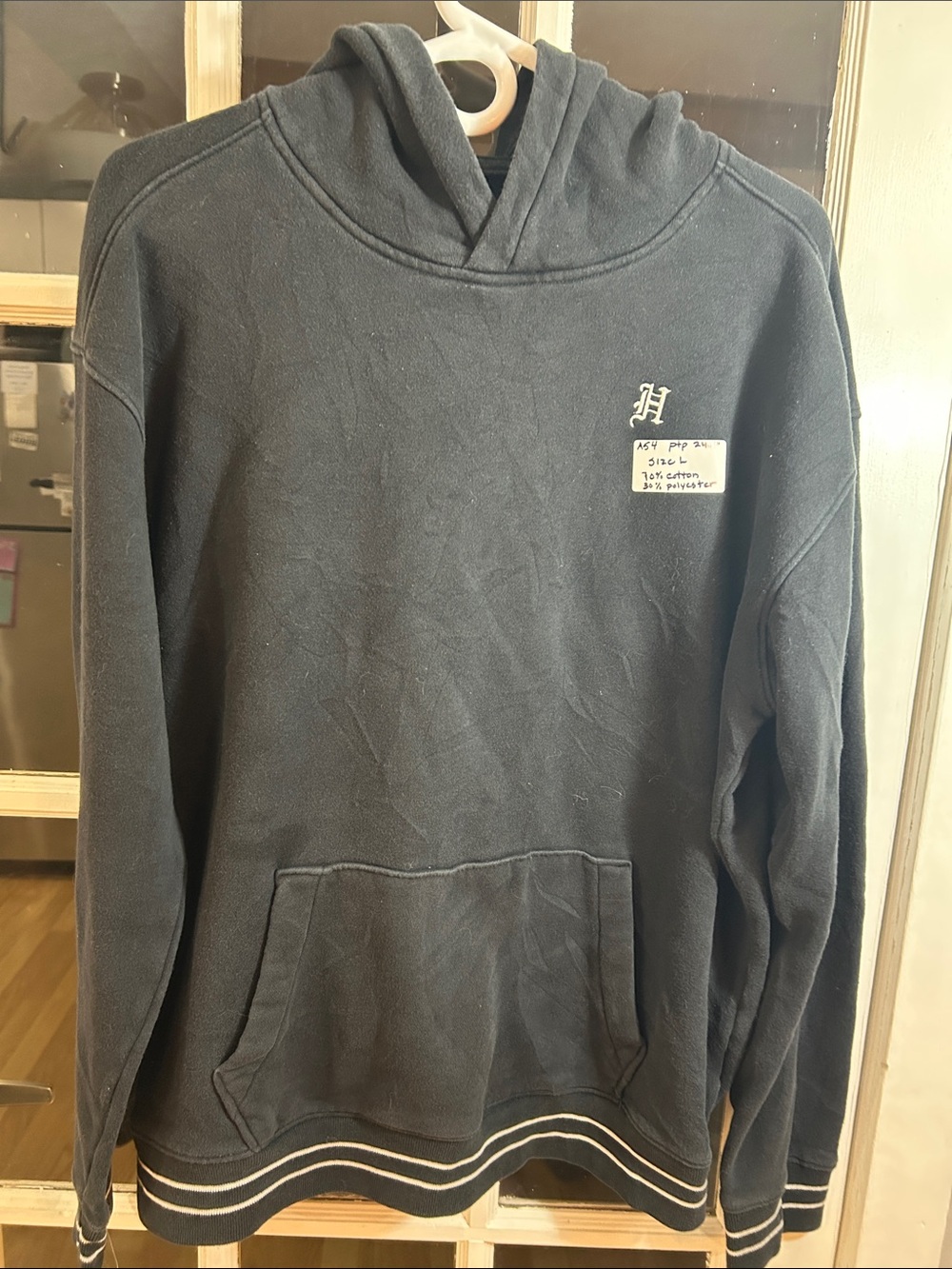 A54.    Men's Black Hooded Sweatshirt with Subtle Chest Emblem